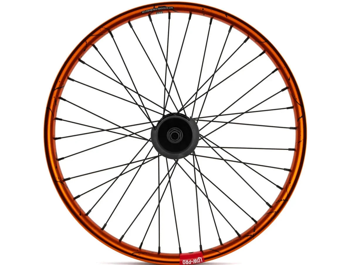 Rueda Rampage Pro Street FreeCoaster robada en color naranja/negro salpicada RHD