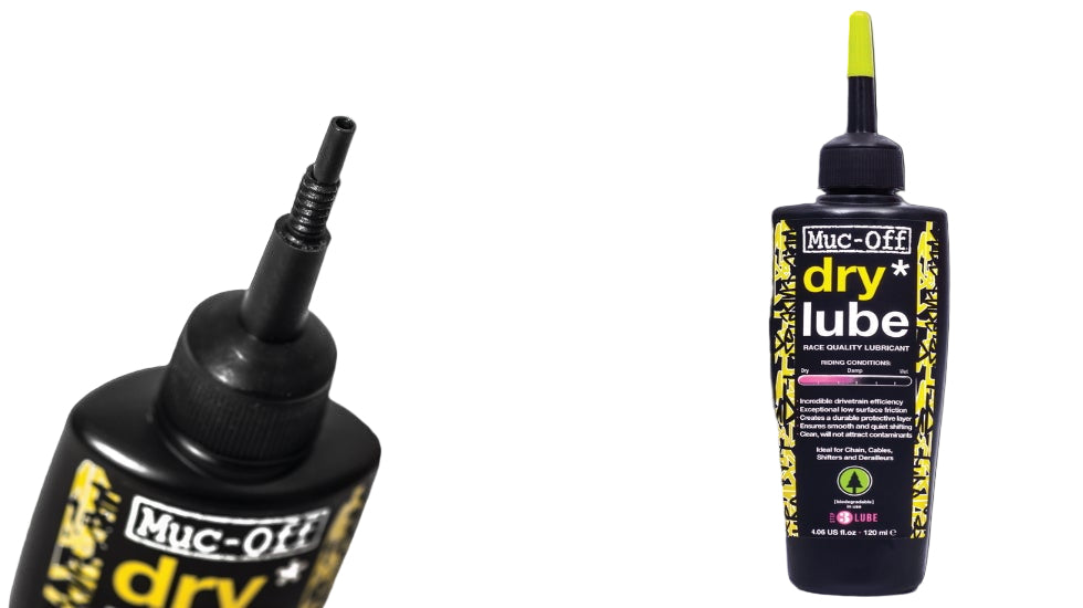 Two bottles of Muc-Off dry lube on a black background
